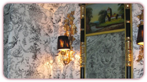 A Classic Toile in an Under-the-Stairs Powder Room